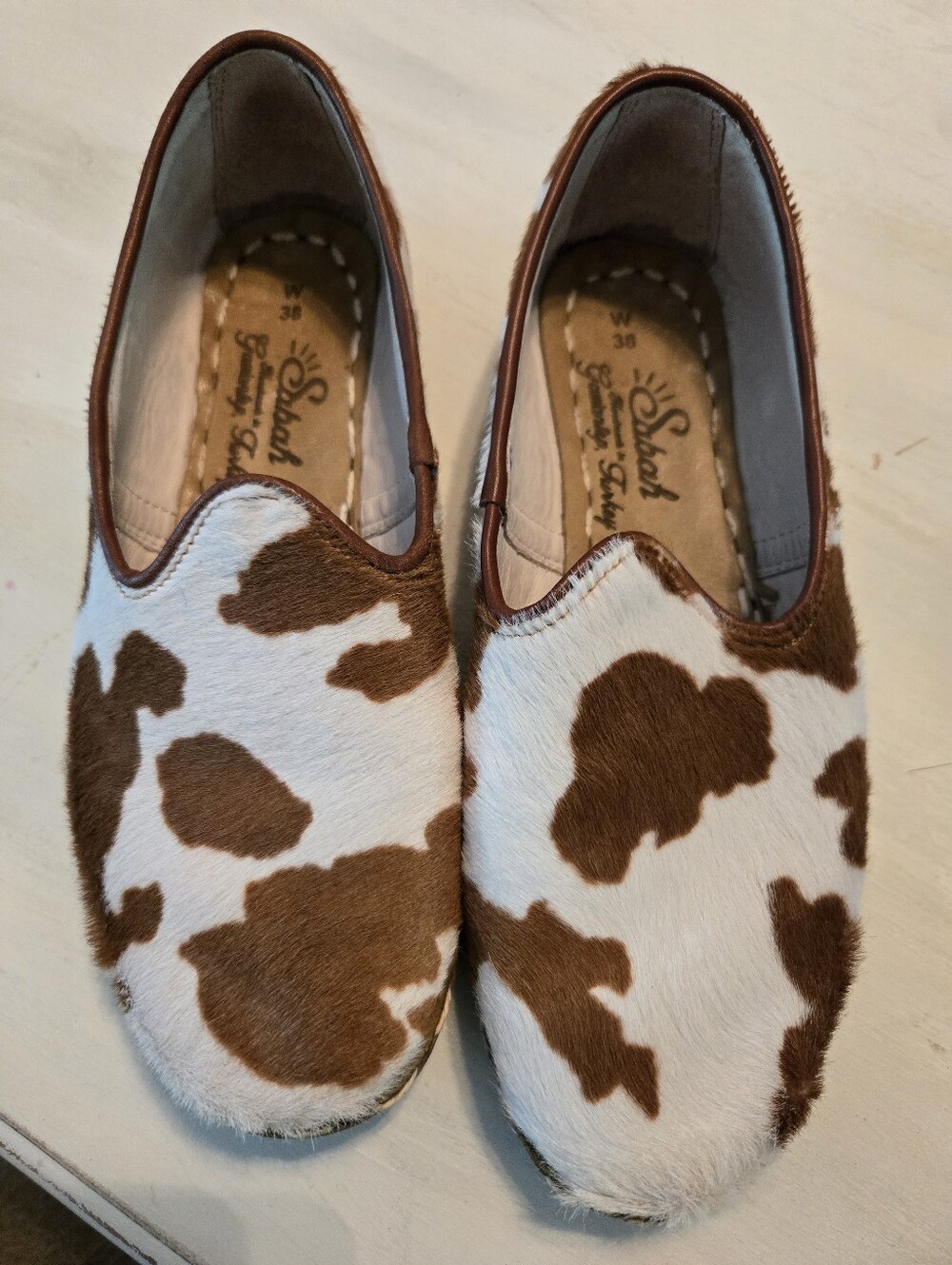 Slip-On Ladies Shoes in White and Brown Cowhide Pattern. SABAH. W38